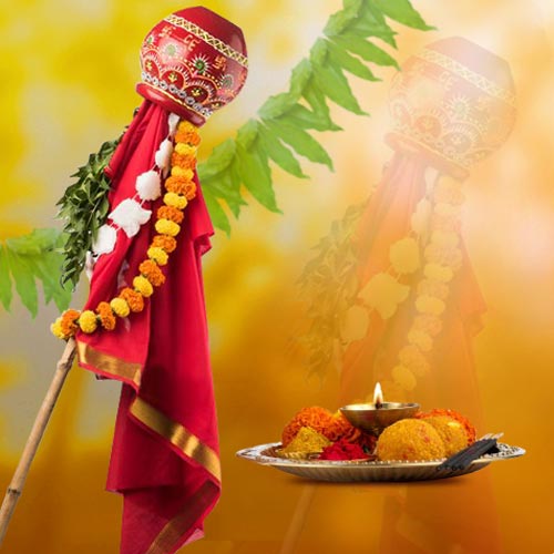 Traditional Gudi Padwa setup with a decorated Gudi, copper kalash, flowers, and sugarcane stick