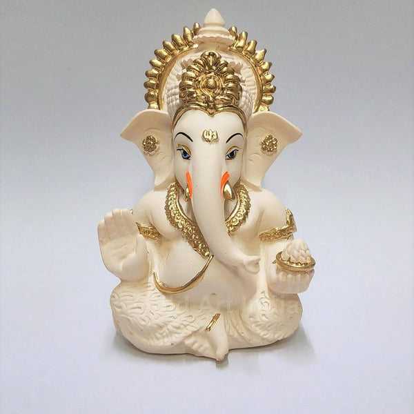 Ivory vs terracotta Ganesha for car dashboard