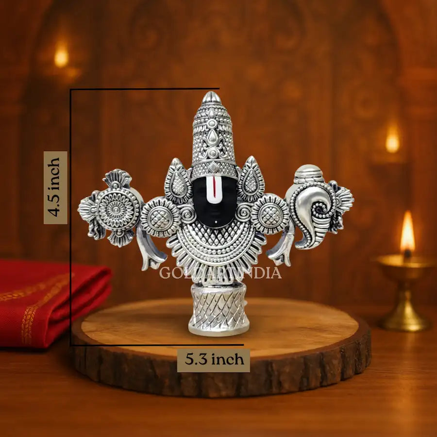 Antique Silver-finish Lord Balaji idol with black face placed on a wooden base.4.5 inch size