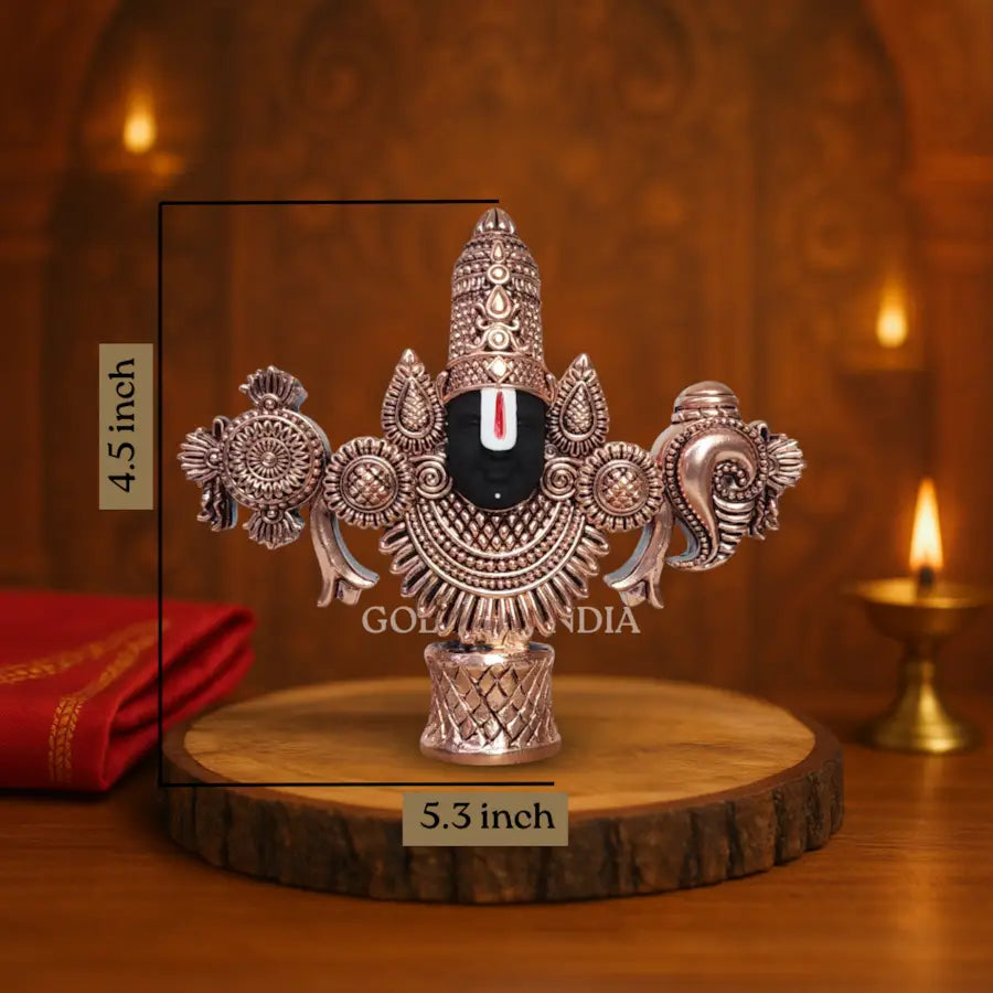Antique copper-finish Lord Balaji idol with black face on wooden base. size