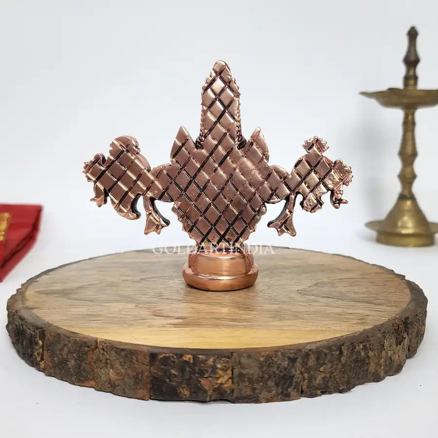 Antique copper-finish Lord Balaji idol with black face on wooden base. backside