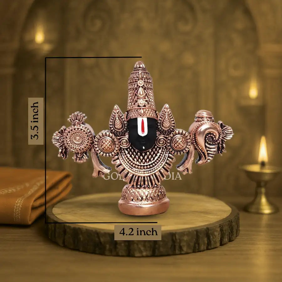 Antique copper-finish Lord Balaji idol with black face on wooden base. size
