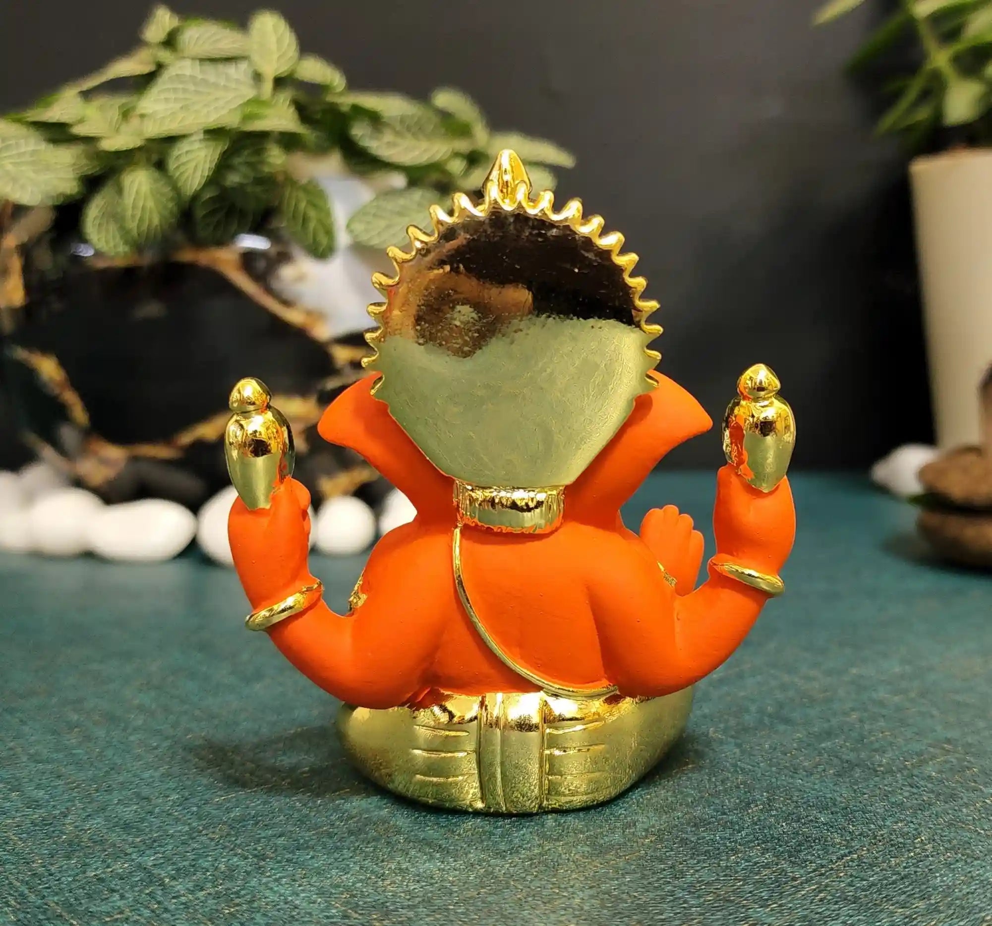 Back view of Orange & Gold Ganesh Idol – handcrafted polyresin statue with fine finish, suitable for puja and festive décor.