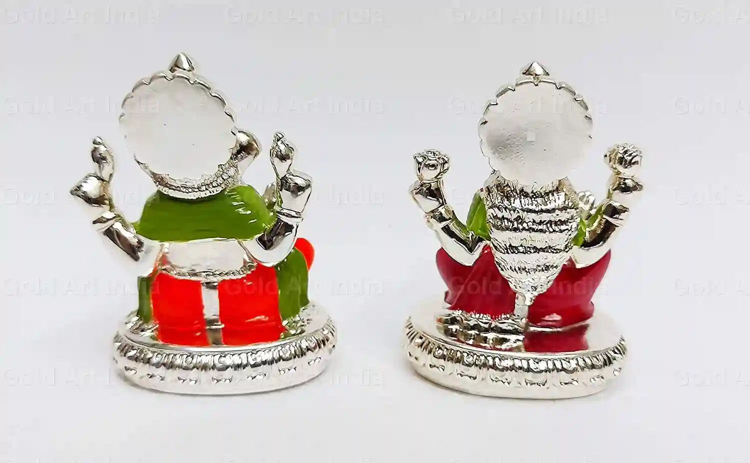 Back view of handcrafted Lakshmi and Ganesha resin idols, silver plated with enamel detailing in red and green attire, compact size design