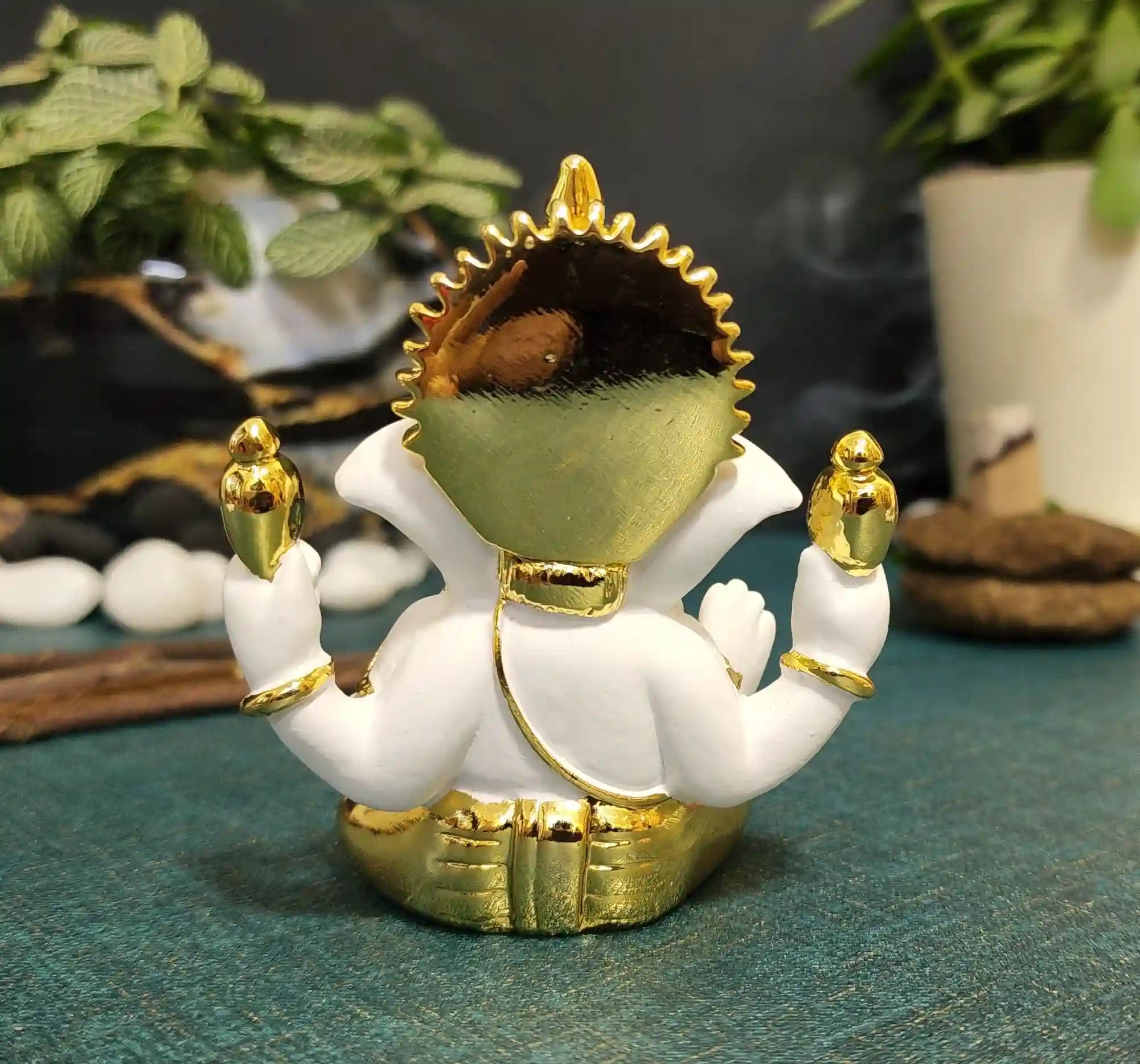 Back view of White & Gold Ganesha Idol showcasing craftsmanship and smooth finish.