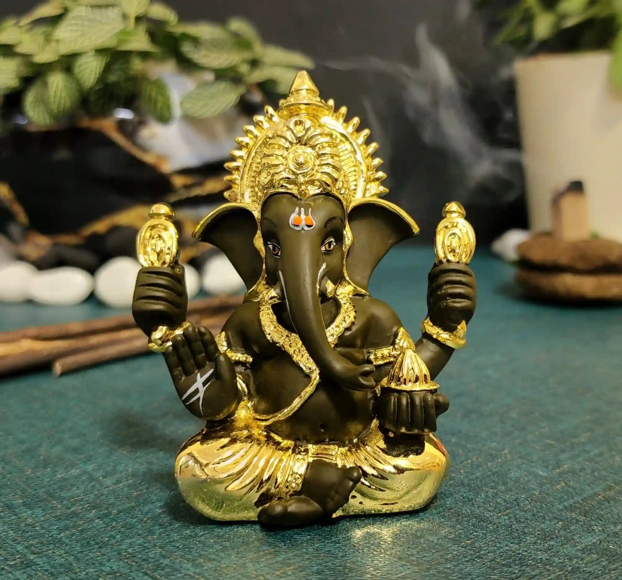 Four-armed Gold & Black Ganesha Idol for car dashboard, puja, and gifting
