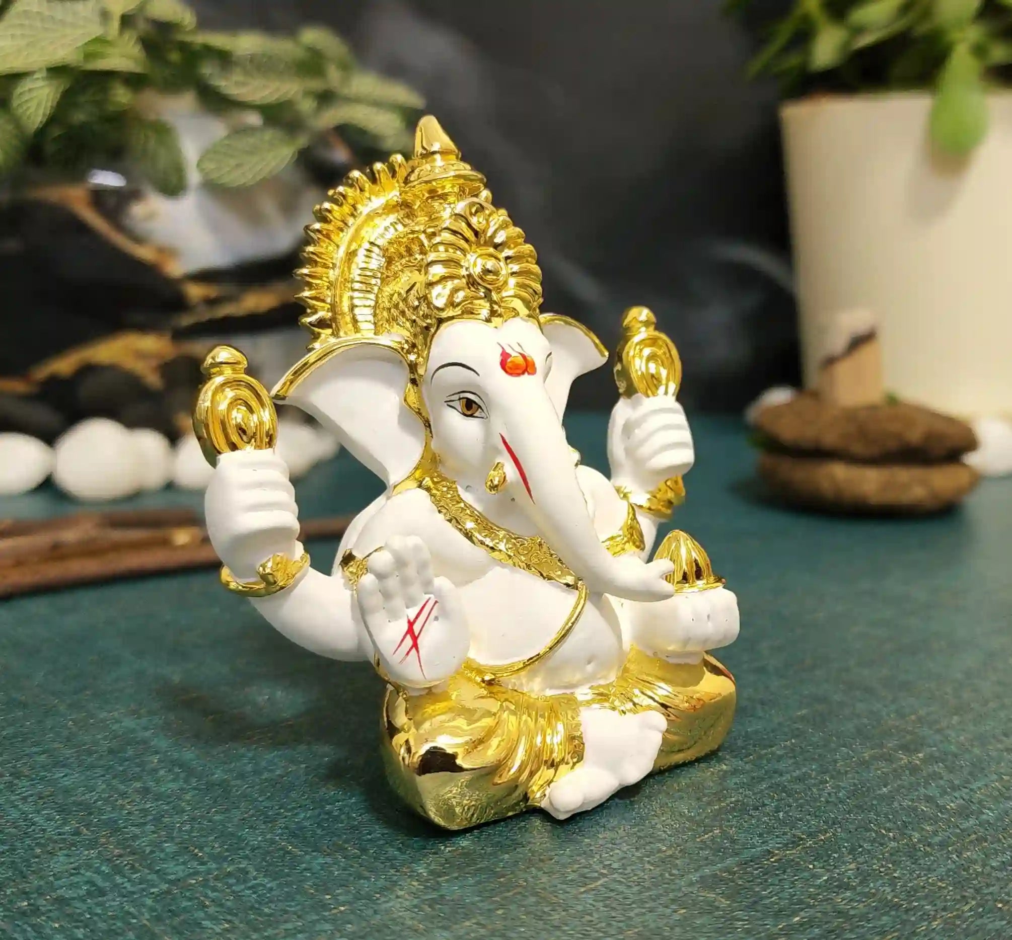 White and Gold Ganesha Murti with elegant design on MDF base for secure placement.