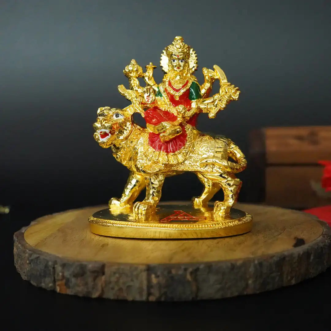 Front view of Gold Plated Maa Durga Idol on lion with red enamel attire, handcrafted Hindu deity statue | Gold Art India