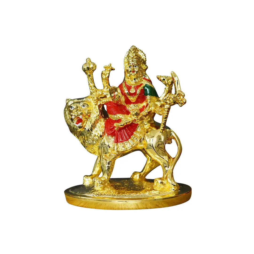 Angled side profile of handcrafted Gold Plated Durga Idol with red enamel clothing, seated on lion