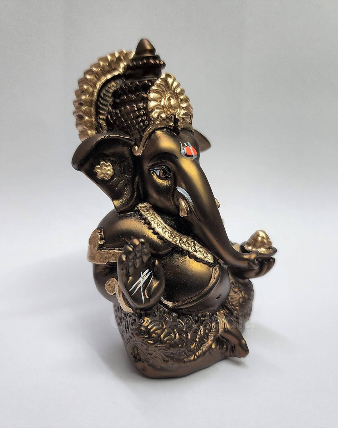 French brown finish Ganesha idol ideal for home and office decor, showcasing intricate details and spiritual presence.
