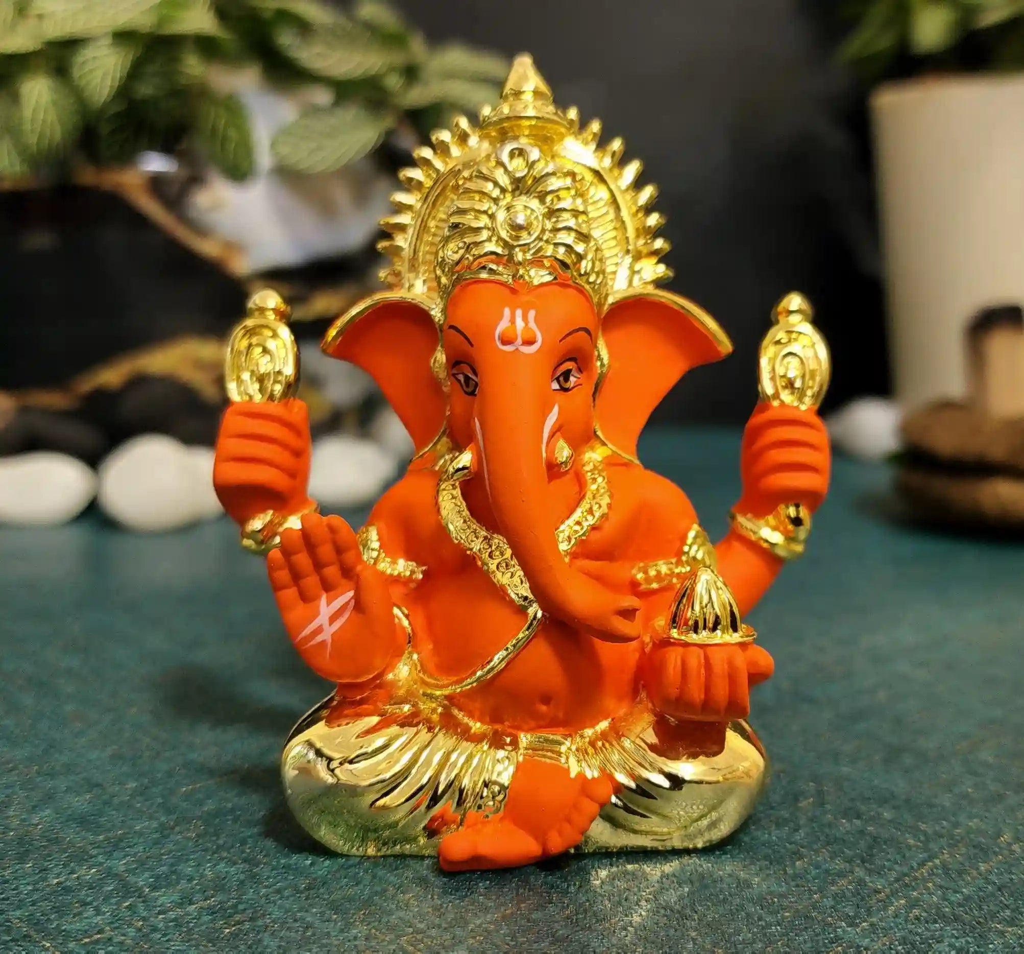 Front view of Orange Ganpati Idol with golden detailing – compact 3.5 inch decorative statue for home mandir, office desk, and décor.