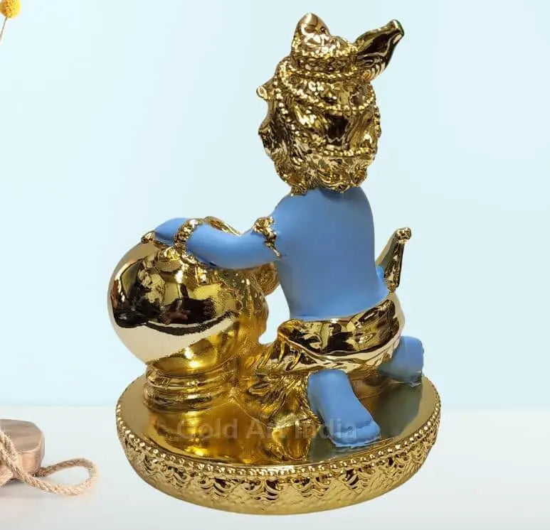 Gold-plated Makhan Krishna idol with blue skin, sitting with a butter pot