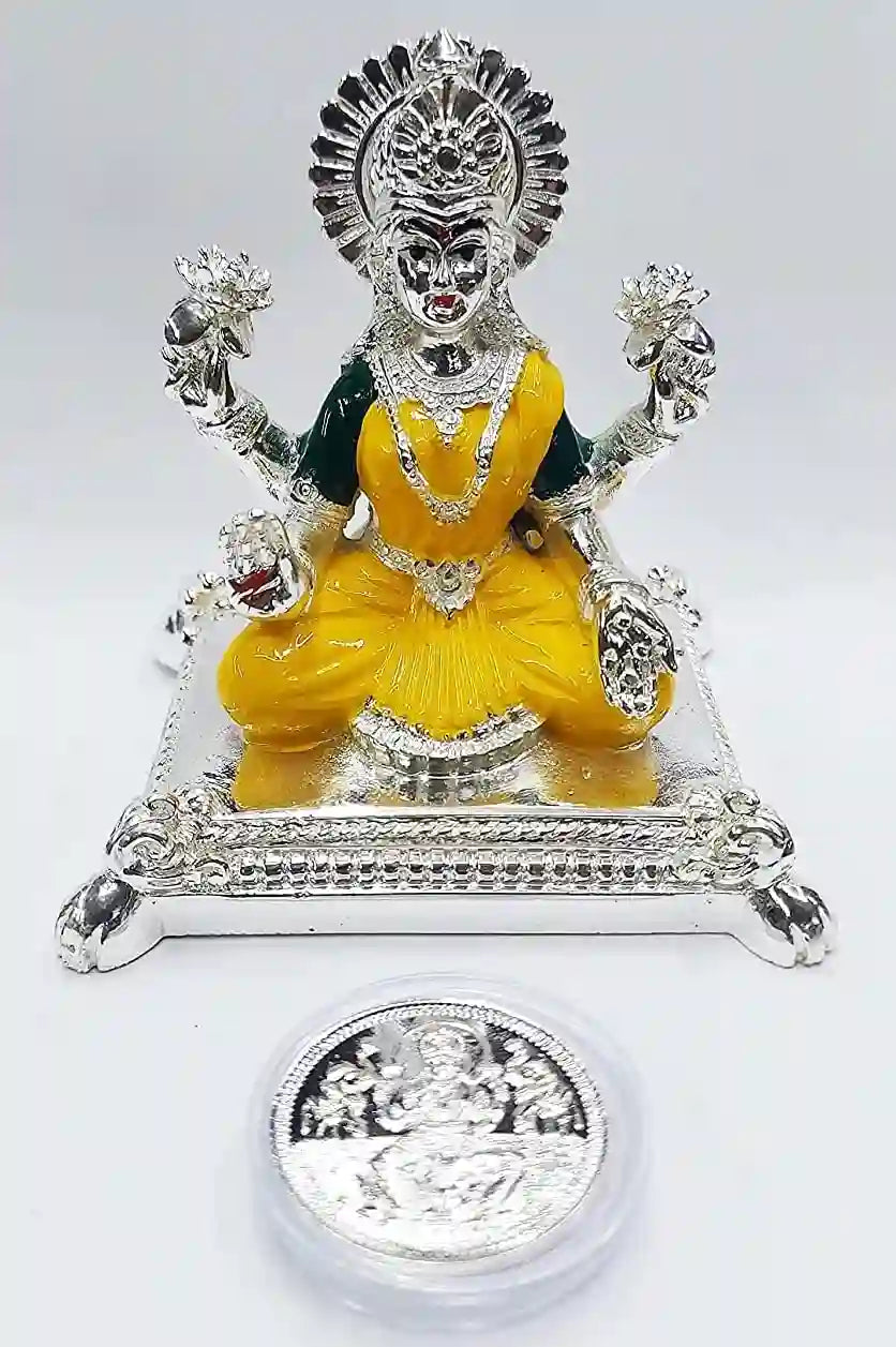 Front view of Pata Laxmi Silver Plated Idol with Yellow Enamel work and silver-plated coin, handcrafted for mandir décor