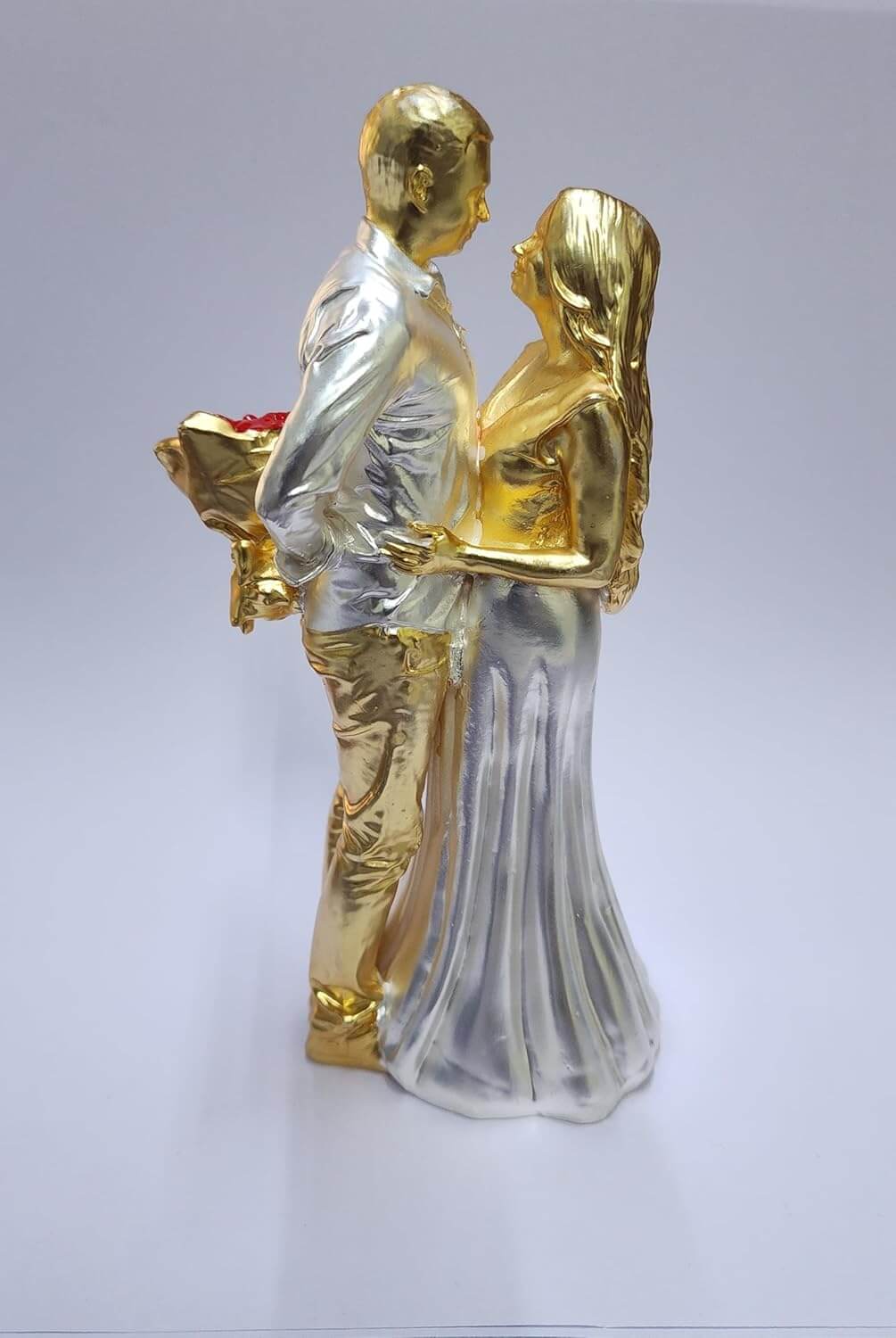 Gold & silver-plated romantic couple figurine with a red rose bouquet.
