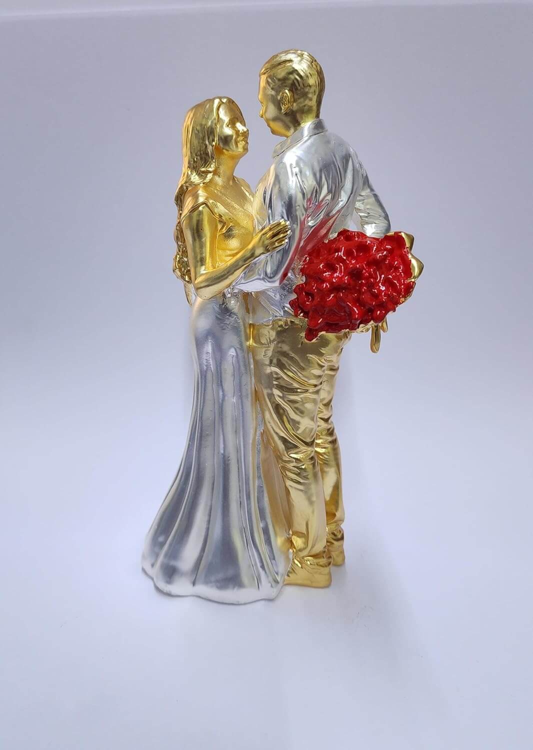 Gold & silver-plated romantic couple figurine with a red rose bouquet.