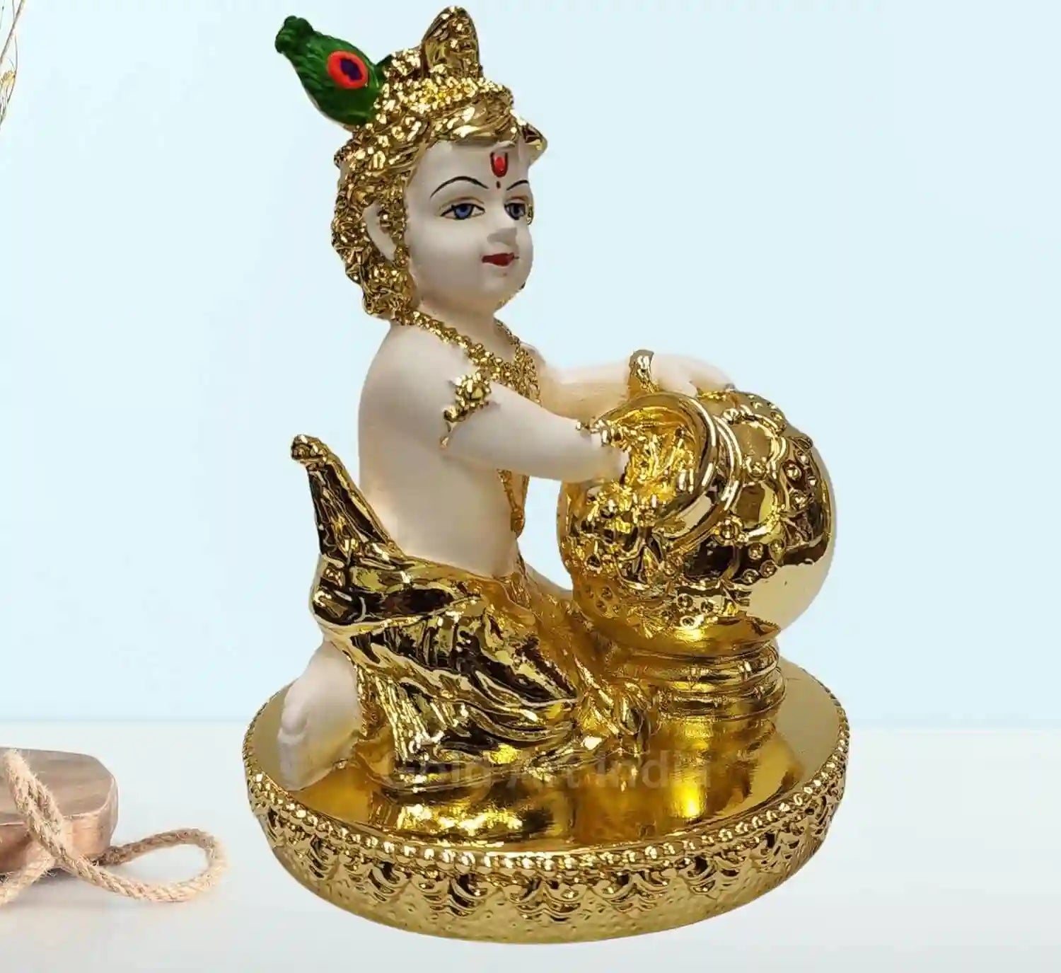 Gold plated off-white Makhan Krishna idol – side profile view