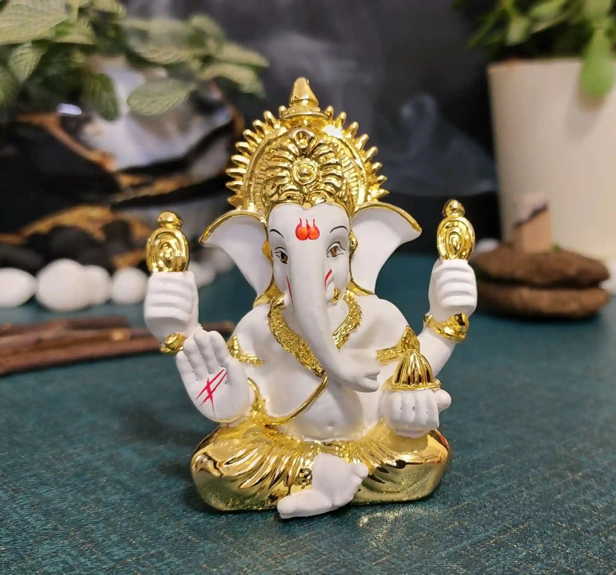 Handcrafted White & Gold Ganesha Idol with divine detailing, perfect for décor & puja.