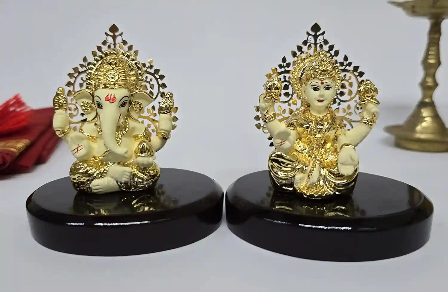 Front view of Kalpavruksh Lakshmi & Ganesha Idol Set with gold-plated off-white terracotta base, 3.3-inch compact design