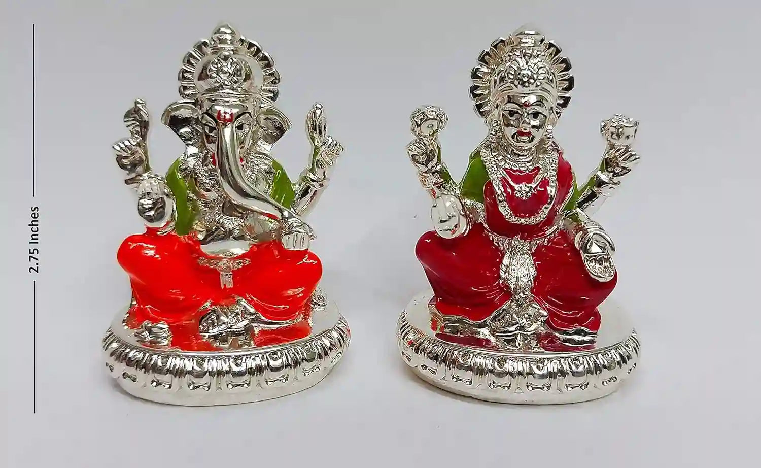 Handcrafted Lakshmi and Ganesha resin idols, silver plated with vibrant red enamel attire, 2.75-inch compact design