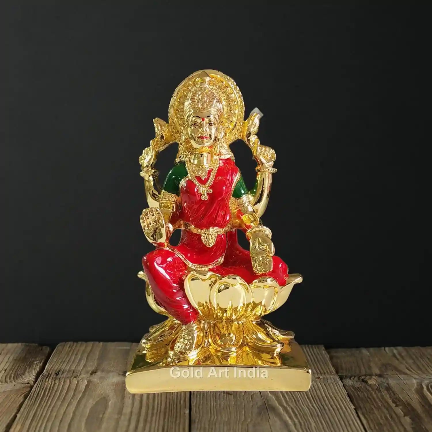 Front view of 7-inch Gold Plated Lakshmi Idol with Red Enamel on golden base | Gold Art India