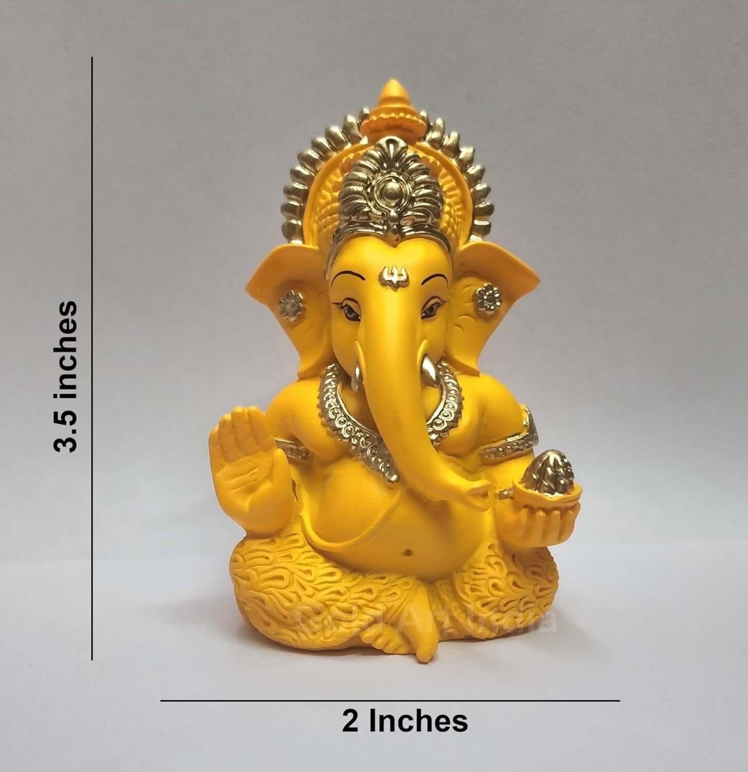 mango terracotta Ganesha idol with Gold detailing, seated in a blessing posture, holding a modak in one hand.dimension 3.5x2 inches