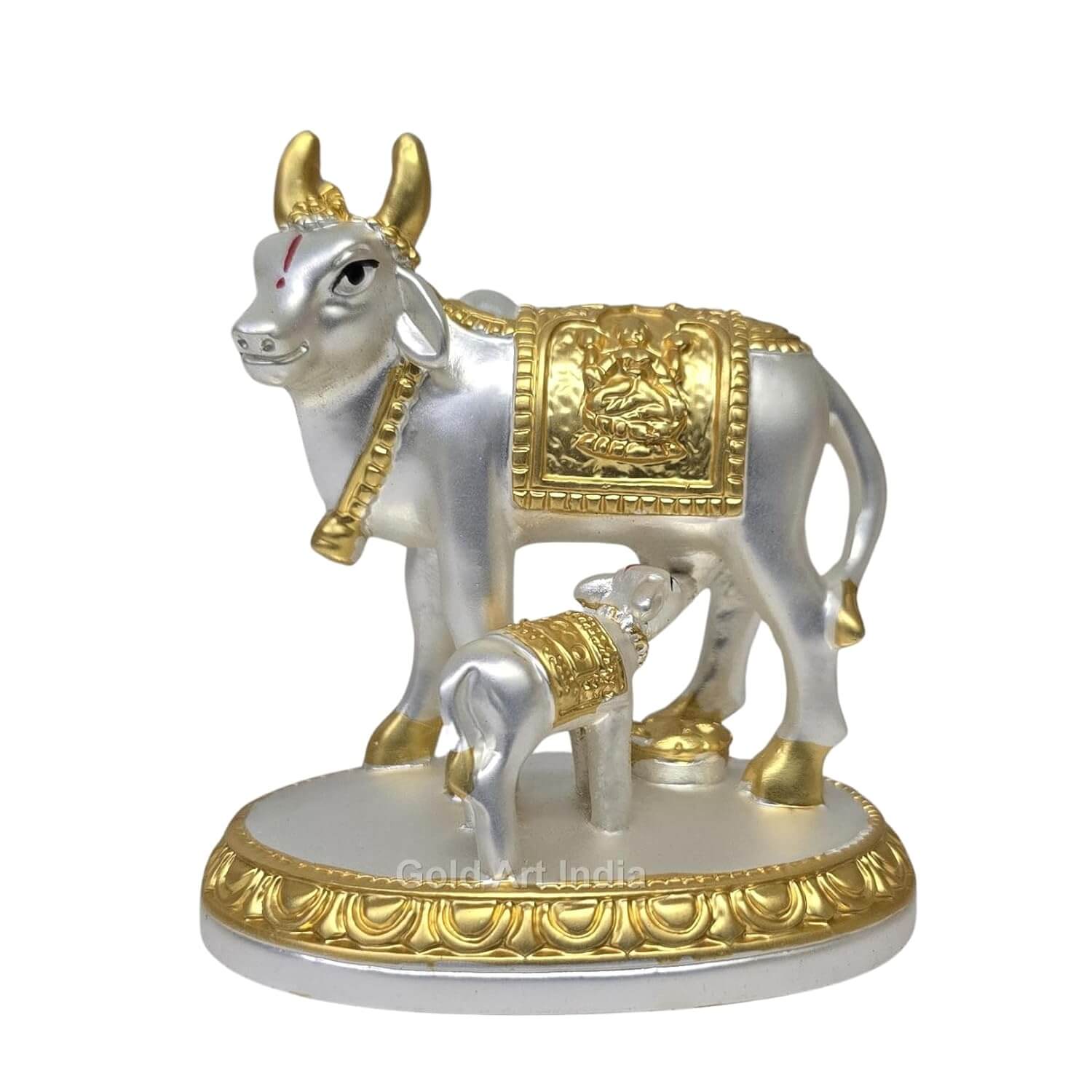 Close-up of gold-plated horns and fine craftsmanship on Kamdhenu cow idol