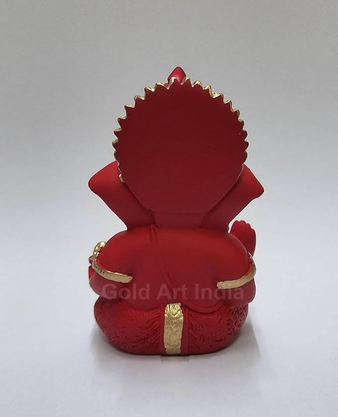 Back view of maroon red terracotta Ganesha idol with golden detailing, perfect for home or car decor.