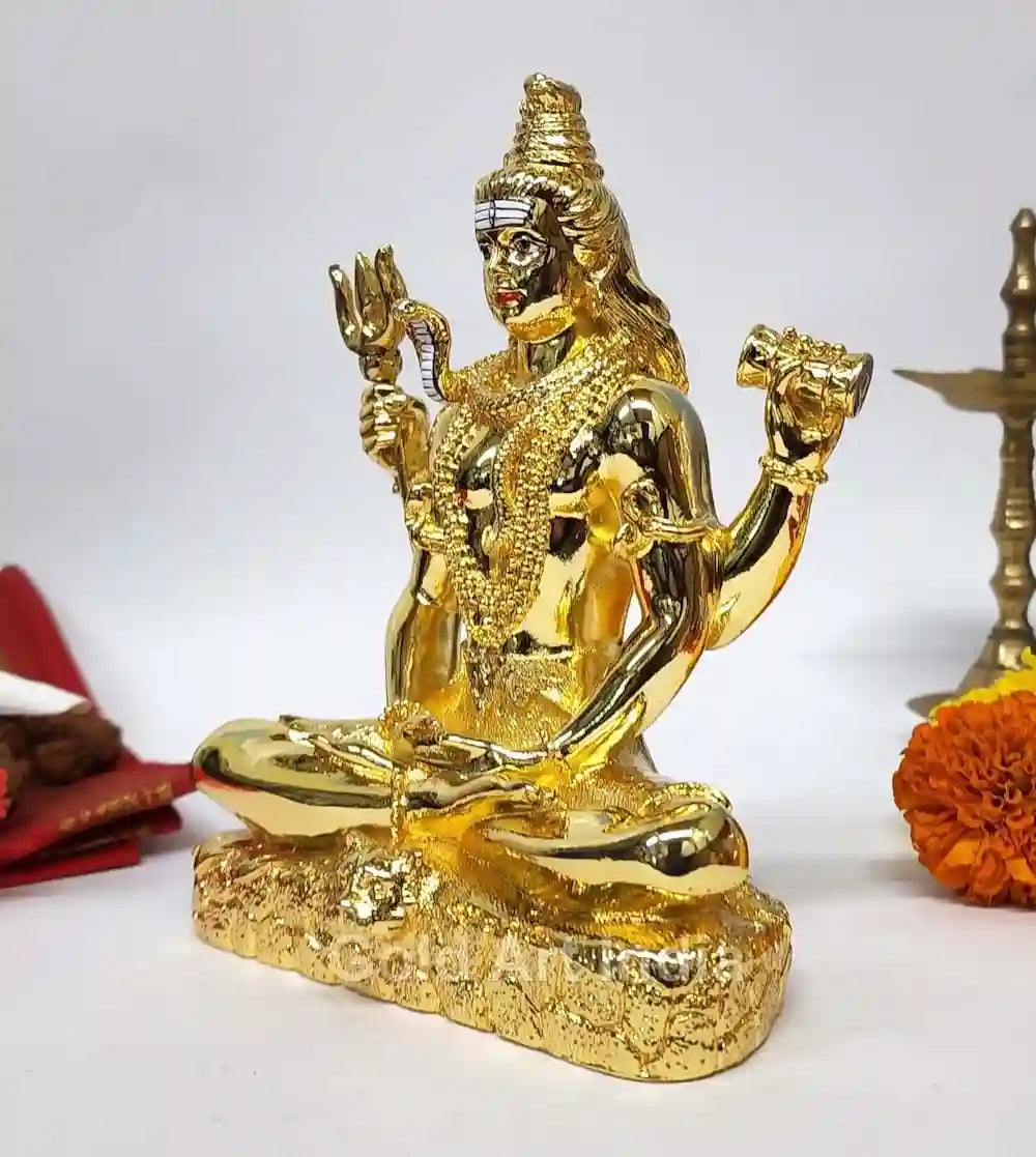 Side angle of gold electroplated Shiva idol showing intricate detailing