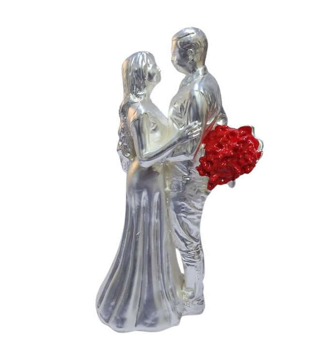 Silver-plated romantic couple figurine with a matte finish, holding A Red rose bouquet.