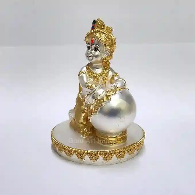 Side view of silver-plated Krishna idol with gold crown and jewelry accents – 4 inch size