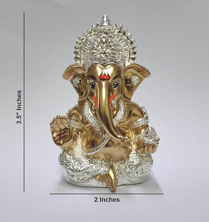 Silver Plated Antique Gold finish Ganesha idol with detailing, seated in a blessing posture, holding a modak in one hand.dimension 3.5x2x inches