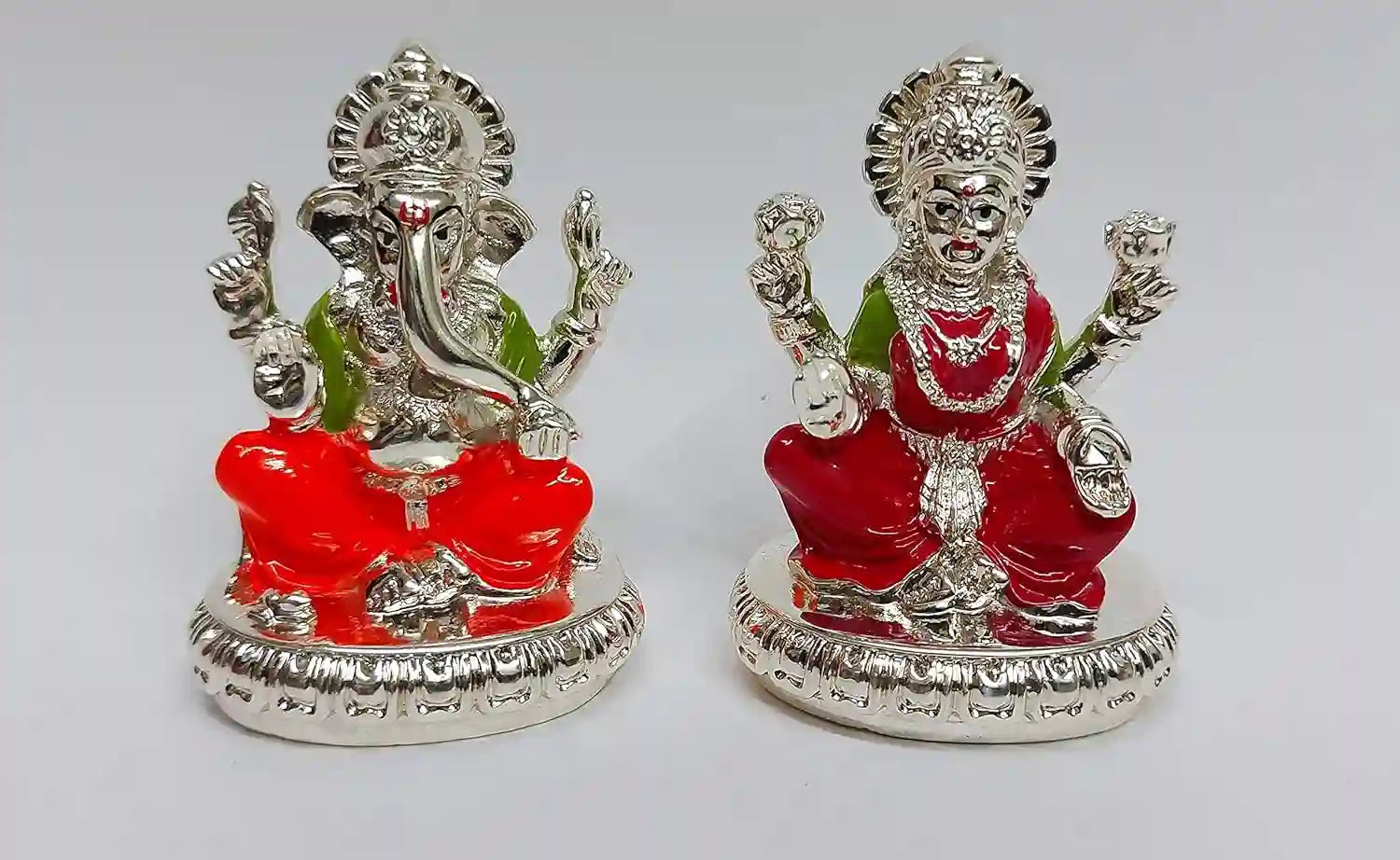 Handcrafted Lakshmi & Ganesha Idols in silver plating with enamel detailing, compact resin design