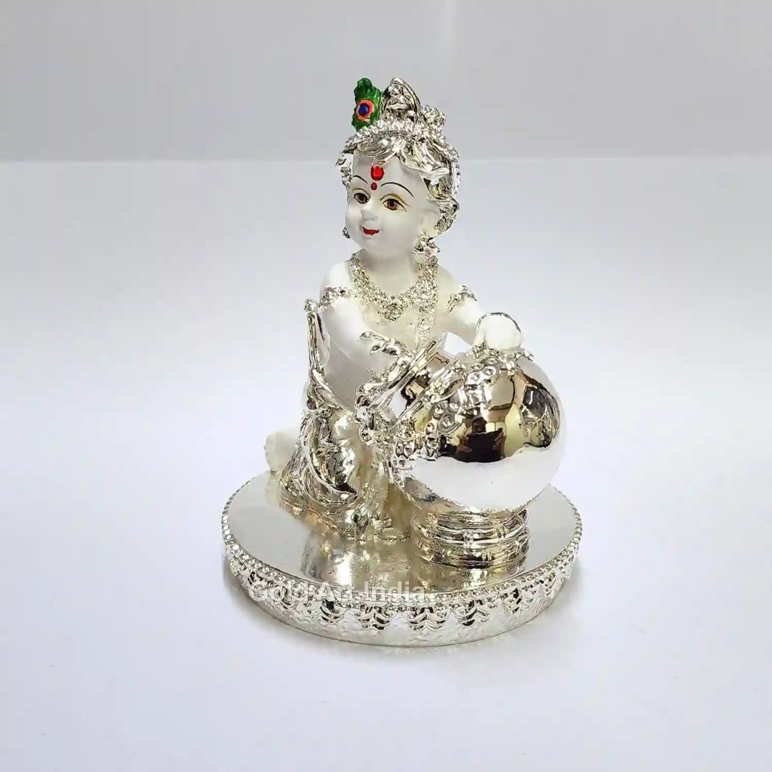Side View of 4 Inch Makhan Krishna Idol with Silver Plating and Peacock Feather Crown