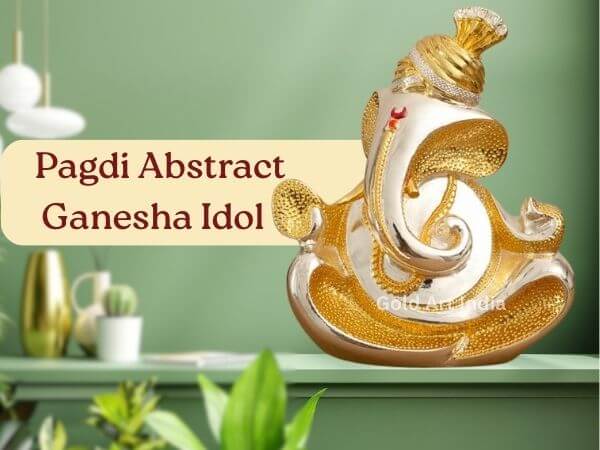 Gold and Silver Plated Pagdi Abstract Ganesha Idol on Green Shelf – Home Decor
