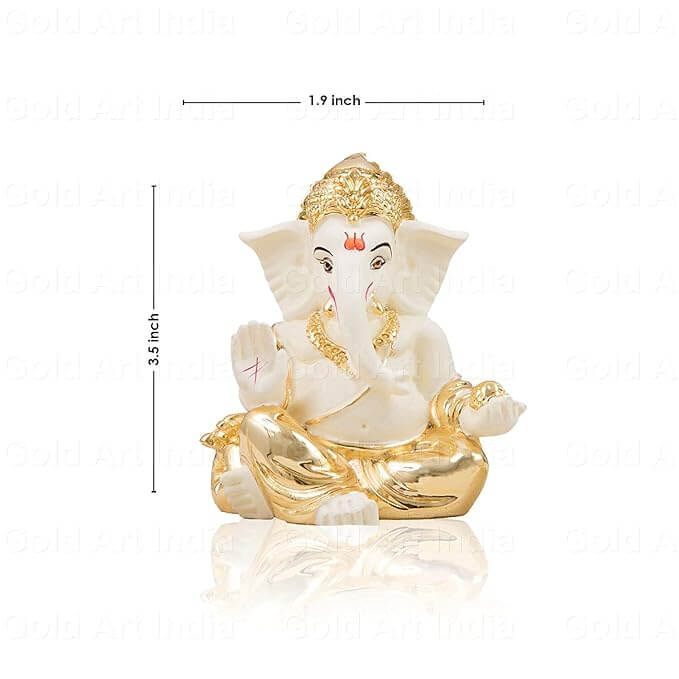 Close-up of Gaddi Ganesha idol’s intricate gold work and ivory finish