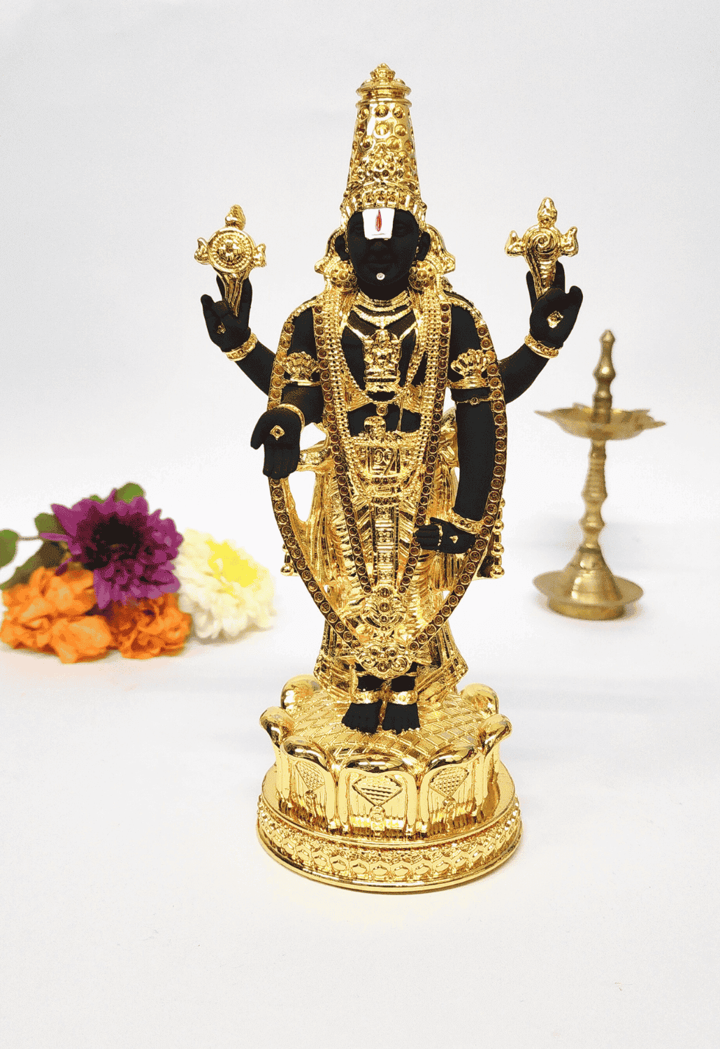 Gold plated Lord Balaji idol in black terracotta with intricate jewelry, ideal for home decor and spiritual gifting.