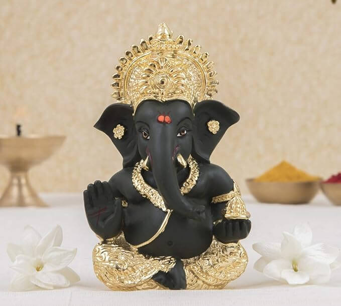 Gold plated Lord Ganesha idol with black finish, perfect for home and office decor, showcasing exquisite craftsmanship.