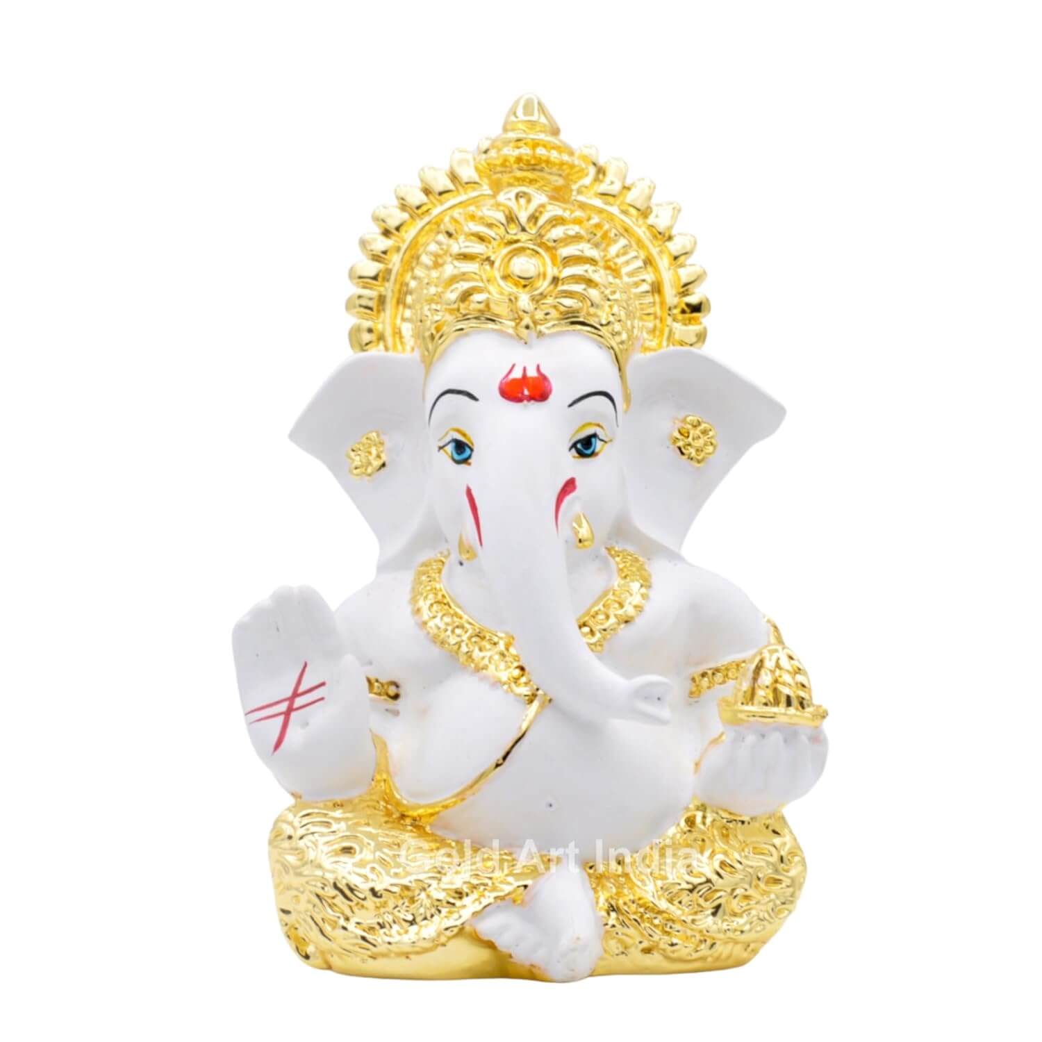 Front view of a white and gold Lord Ganesha idol with intricate detailing, a blessing hand, and a modak in the other.
