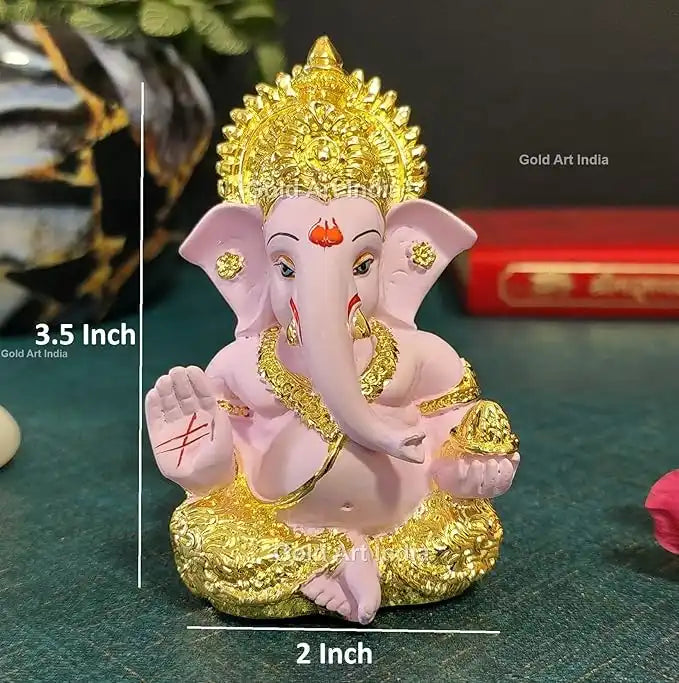 Front view of a white and gold Lord Ganesha idol with intricate detailing, a blessing hand, and a modak in the other. size