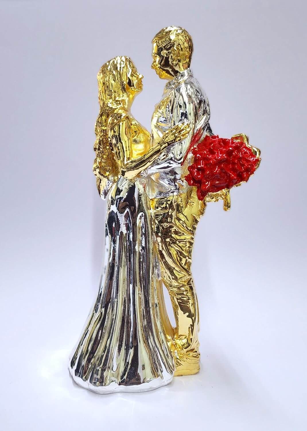 Gold & silver-plated romantic couple figurine with a red rose bouquet.
