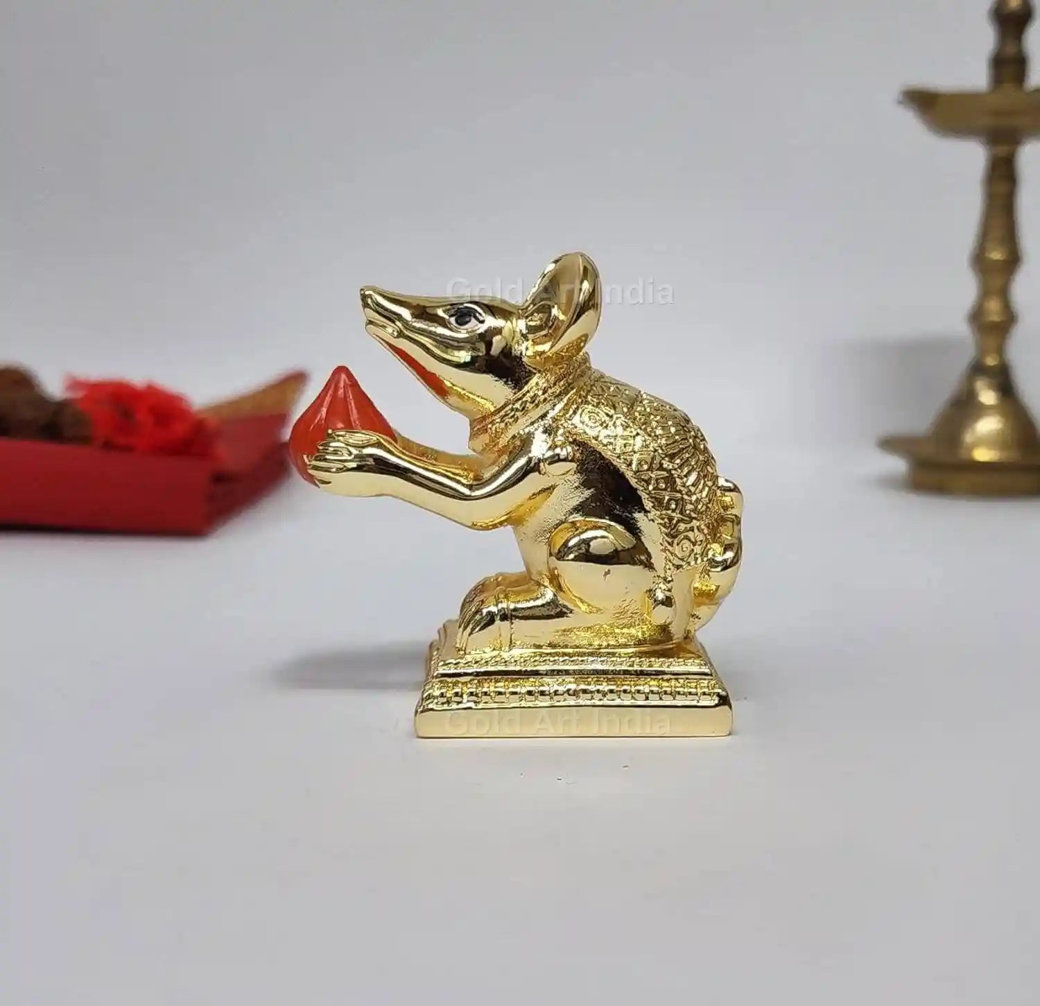 Gold-plated Mushak idol with modak – orange terracotta finish