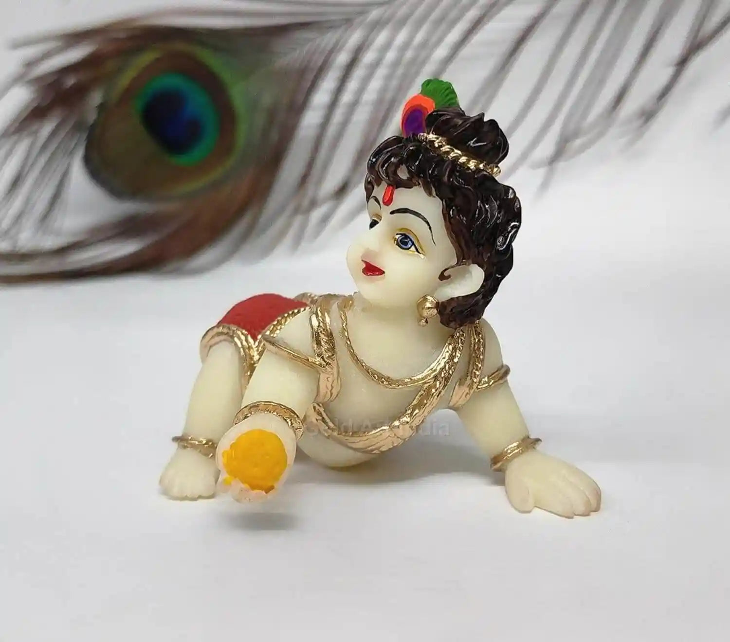 Ivory Laddu Gopal idol with red dhoti, depicting Little Krishna, perfect for home decor and gifting.
