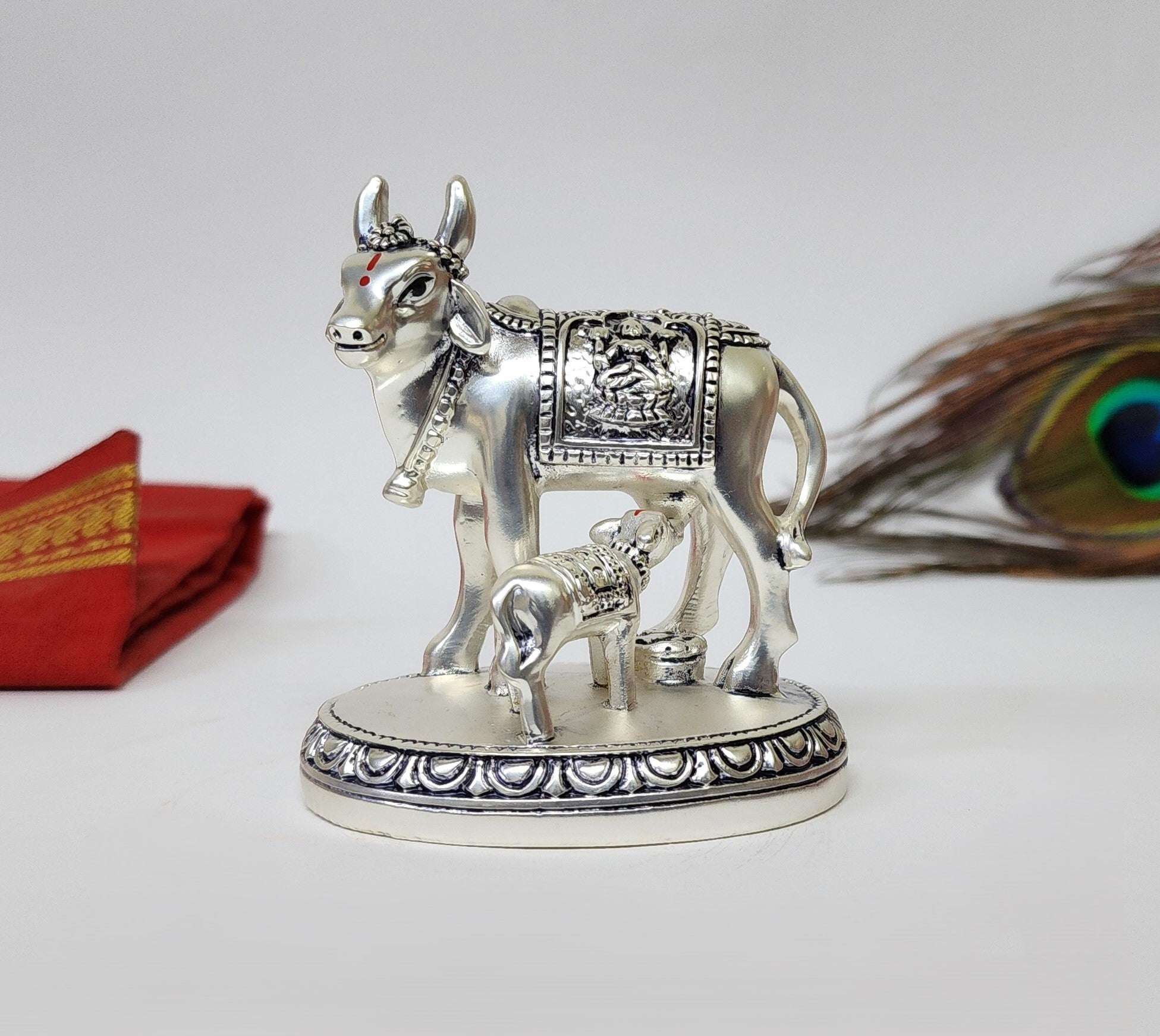 Silver plated Kamdhenu Cow and Calf idol with Laxmi symbol