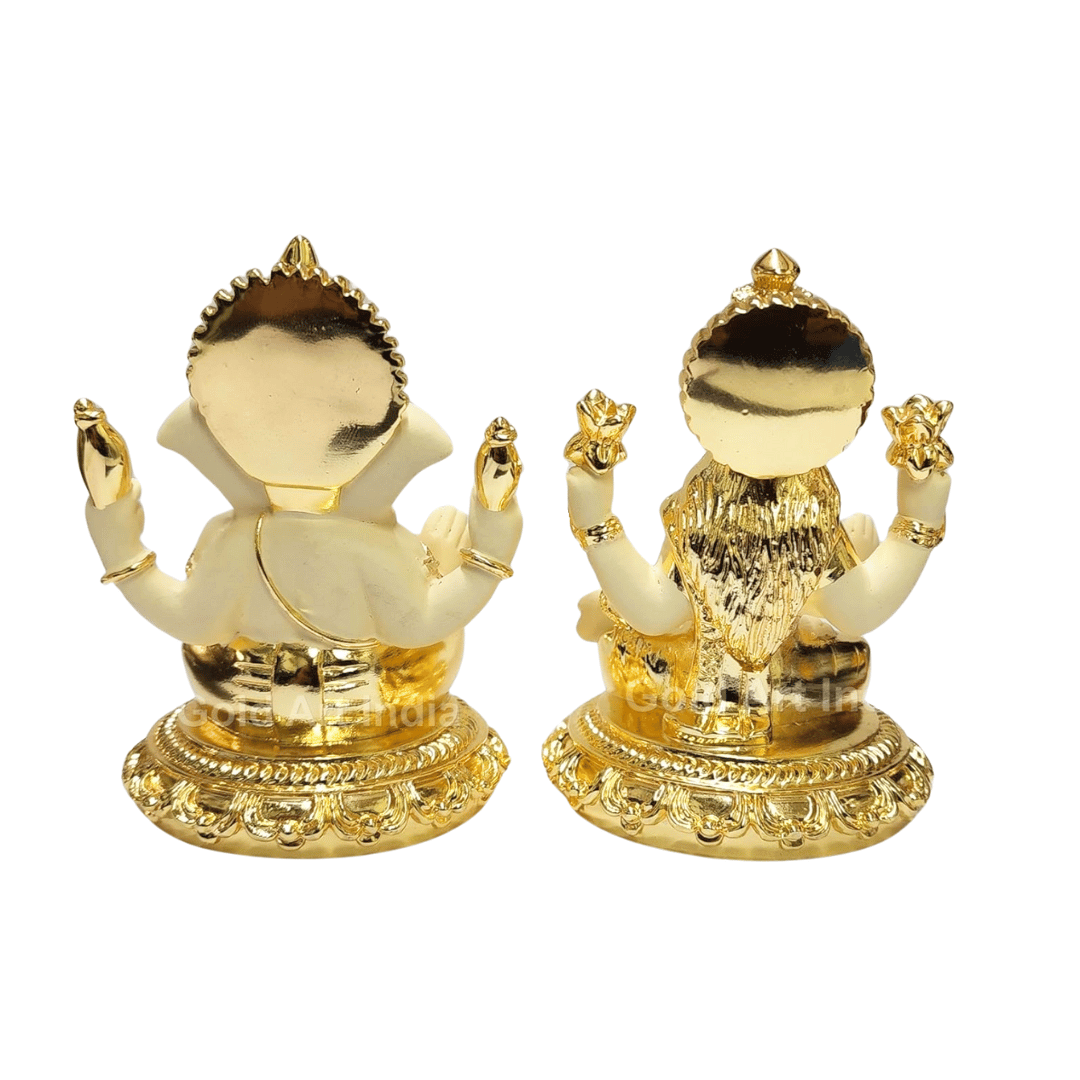 Gold plated off-white terracotta idols of Lord Ganesha and Goddess Laxmi sitting on intricately designed bases, ideal for puja, home decor, and gifting.