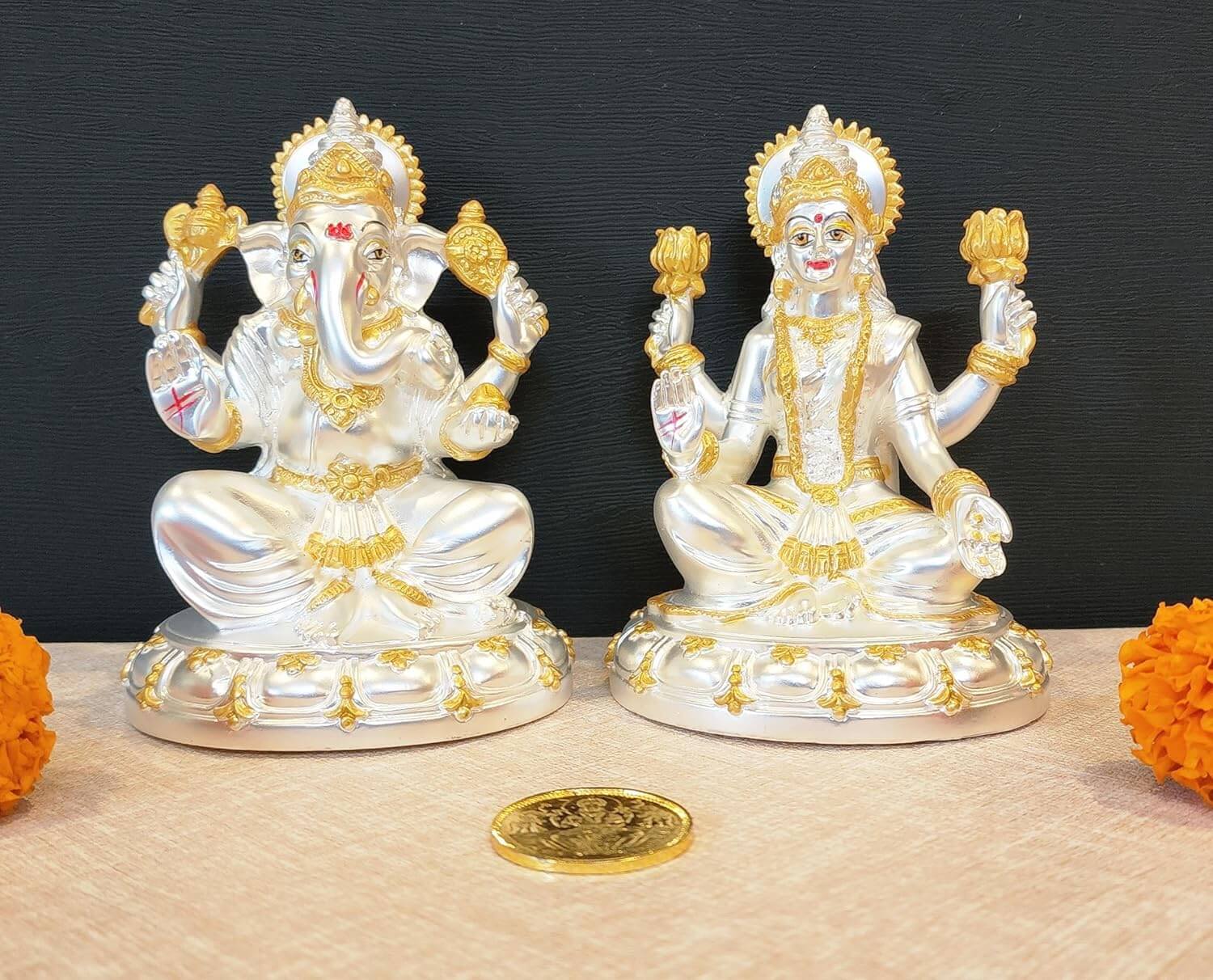 Silver plated matte finish Laxmi and Ganesha idol set with gold accents, perfect for Diwali and home decor.
