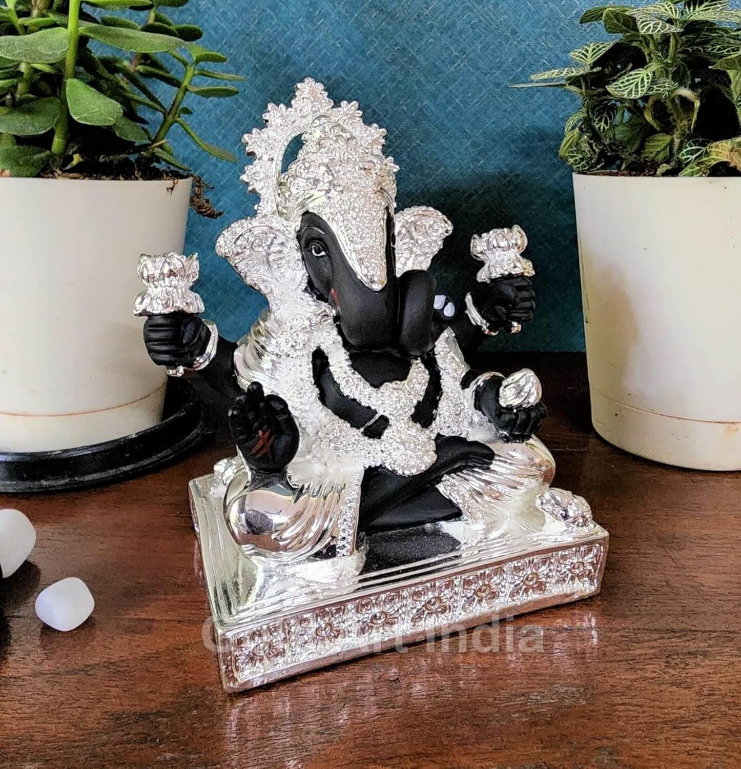 Side angle view of black and silver Dagdusheth-style Ganesha idol for home decor
