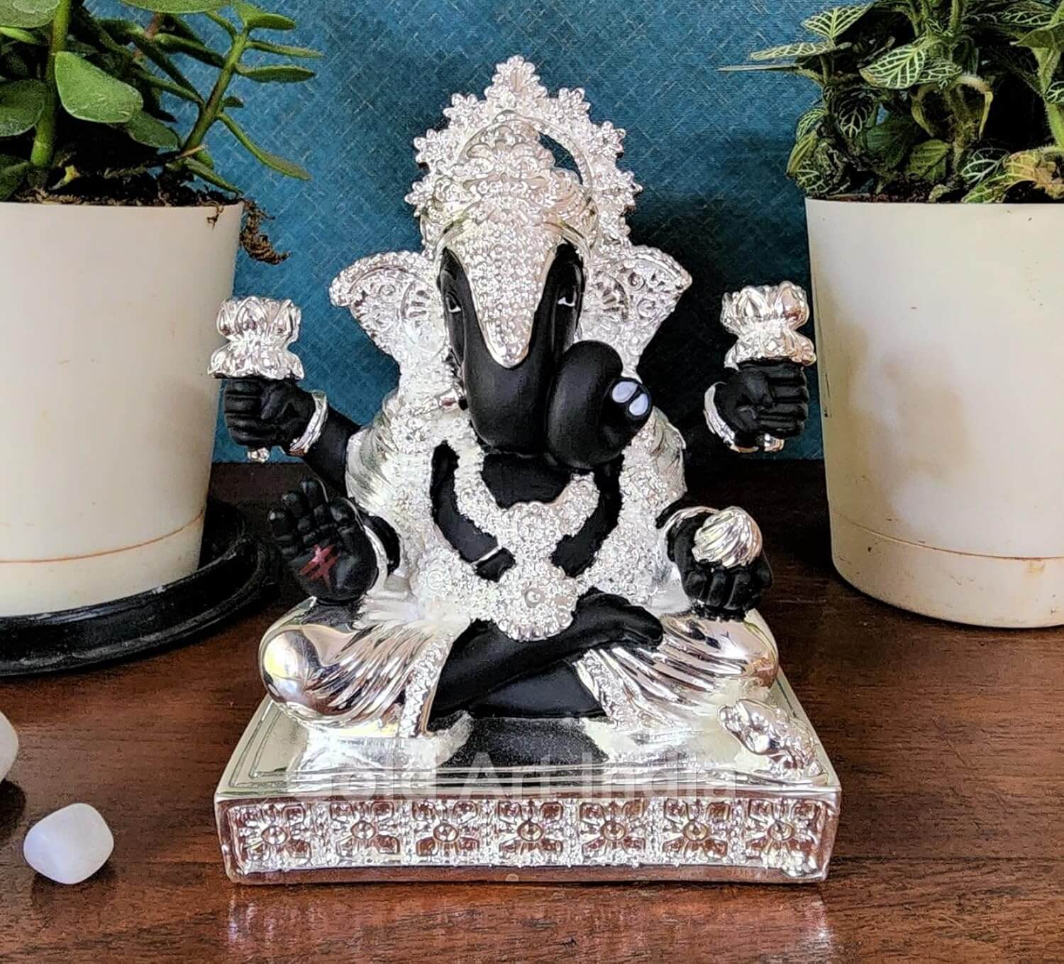 Lord Ganesha idol with black terracotta finish and 999 silver plating โ front view