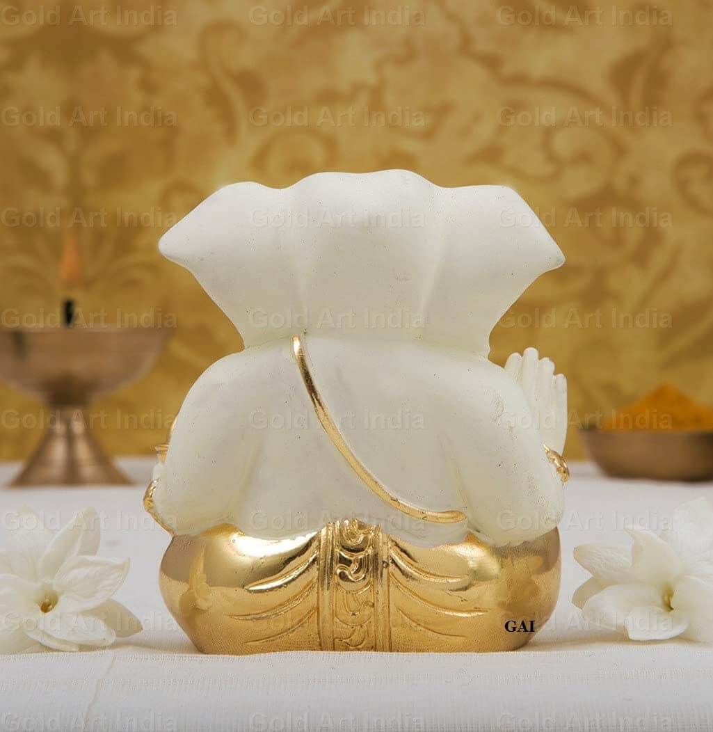 Gold plated off white terracotta Ganesha idol, 2 inches, perfect for car decor and gifts.