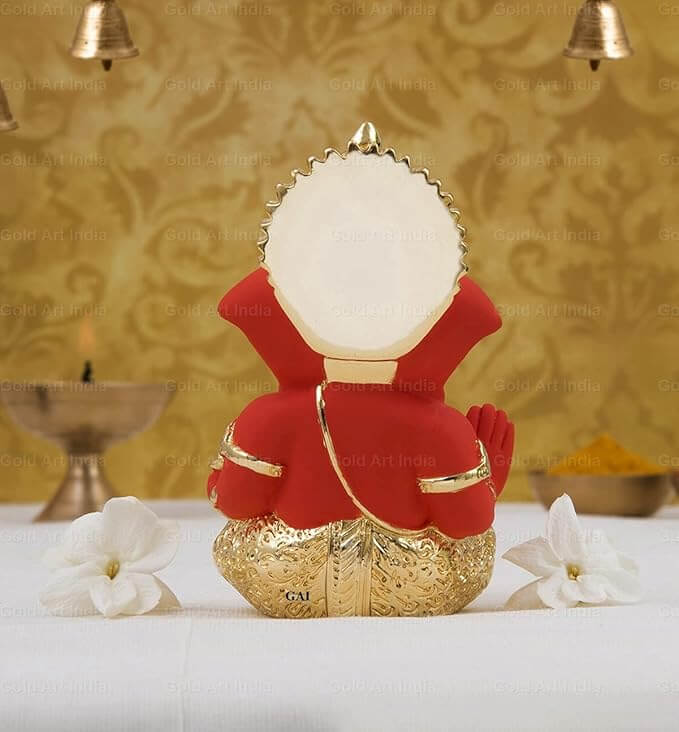 Back view of a Gold Plated Orange Lord Ganesha Idol in a decorative setting, ideal for home decor and gifts.