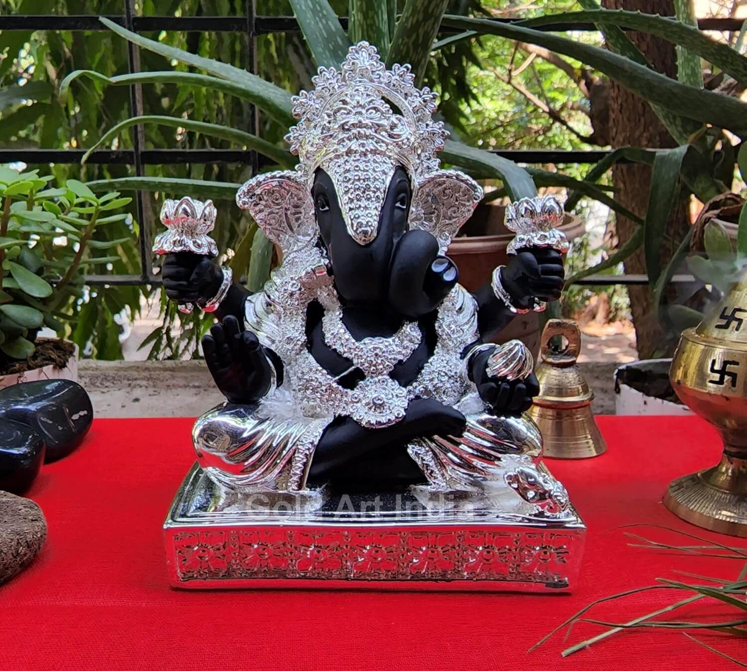 Close-up of 999 silver plated Ganesha idol with intricate crown and ornament